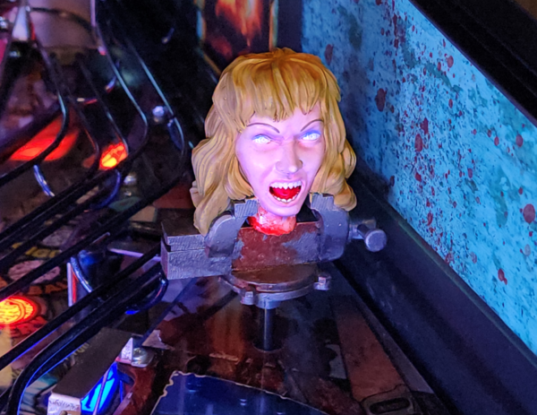 Evil Dead pinball machine, Evil Dead Collector's Edition pinball, Bruce Campbell pinball machine, Limited edition Evil Dead pinball, Spooky Pinball Evil Dead, Horror movie pinball machine, am Raimi Evil Dead pinball, Evil Dead 2 pinball game, Ash Williams pinball machine, Necronomicon pinball feature, Wide-body pinball machine, Motorized pinball toys, Evil Dead vs. other horror pinballs, Collector’s edition pinball cost, Evil Dead pinball machine for sale near me, Pinball expo Evil Dead edition
