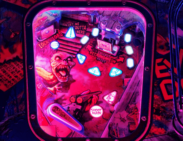Evil Dead pinball machine, Evil Dead Collector's Edition pinball, Bruce Campbell pinball machine, Limited edition Evil Dead pinball, Spooky Pinball Evil Dead, Horror movie pinball machine, am Raimi Evil Dead pinball, Evil Dead 2 pinball game, Ash Williams pinball machine, Necronomicon pinball feature, Wide-body pinball machine, Motorized pinball toys, Evil Dead vs. other horror pinballs, Collector’s edition pinball cost, Evil Dead pinball machine for sale near me, Pinball expo Evil Dead edition